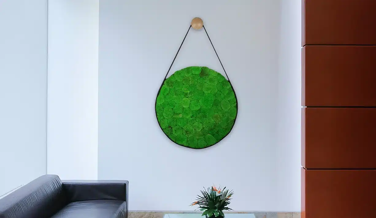 Green moss wall art in modern living room.