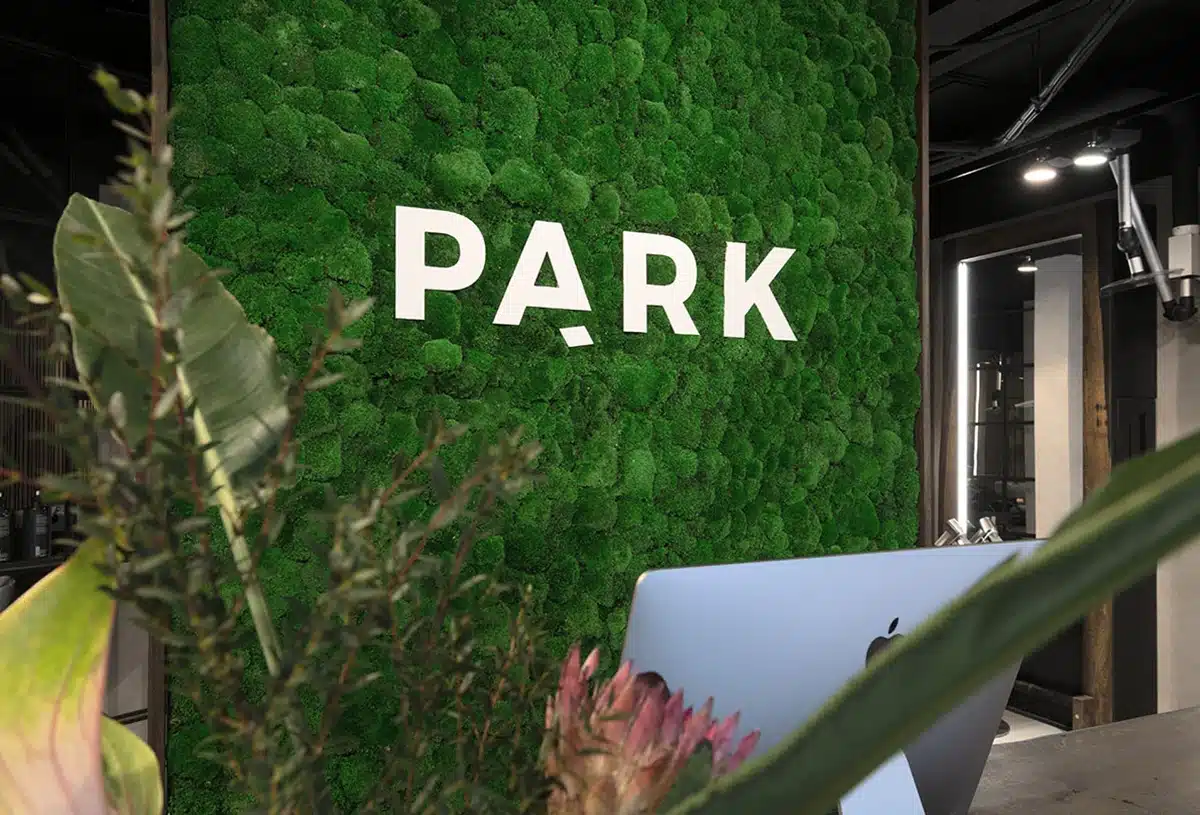 Green wall with 'PARK' sign