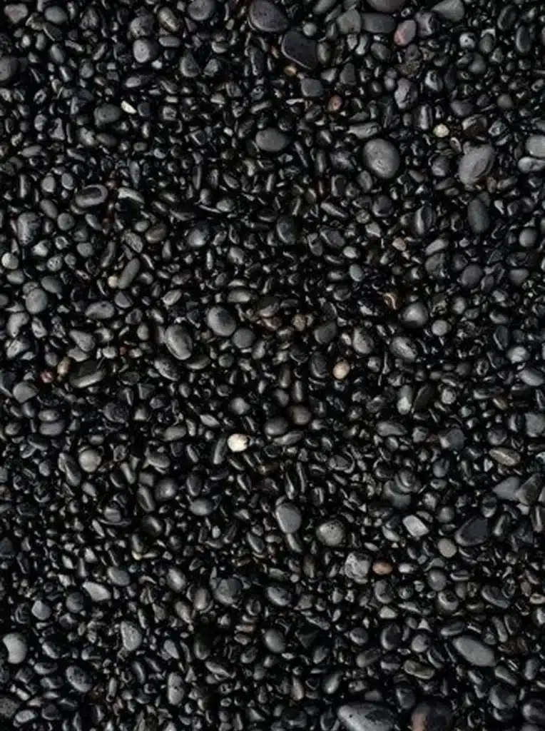 Close-up of black pebbles on a beach